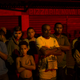 “Residents watch as police work the crime scene where a man was murdered in Mage, greater Rio de Janeiro, Brazil.”